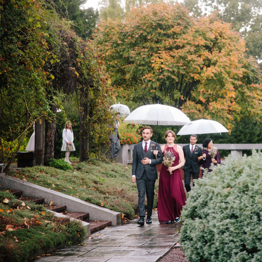 wedding party walking through the national herb garden