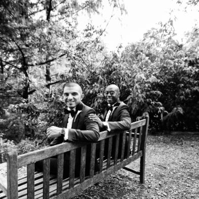 Grooms sitting together on a bench in the Asian Collections