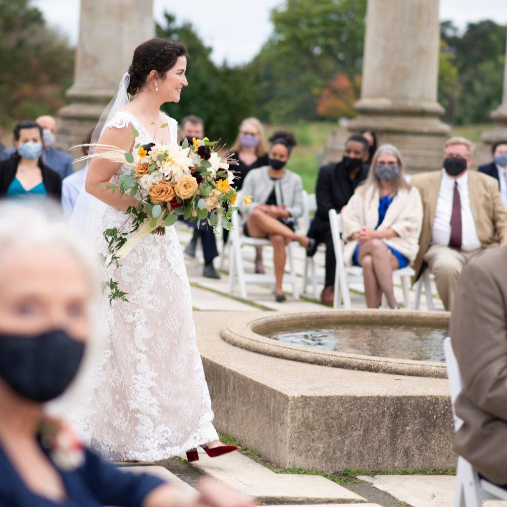 Bride walking down the isle in the Capitol Columns