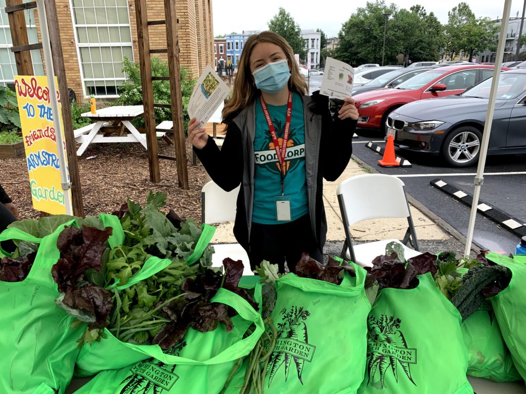 Foodcorps service members at a produce distribution at a FONA partner school