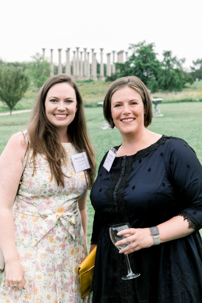 solstice soiree guests in front of the capitol columns