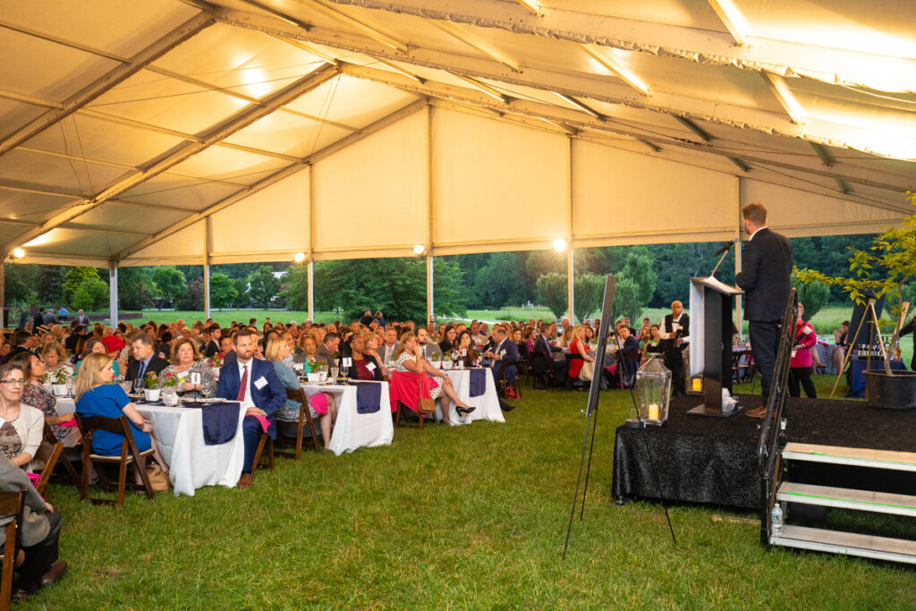 dinner under the stars guests under the tent