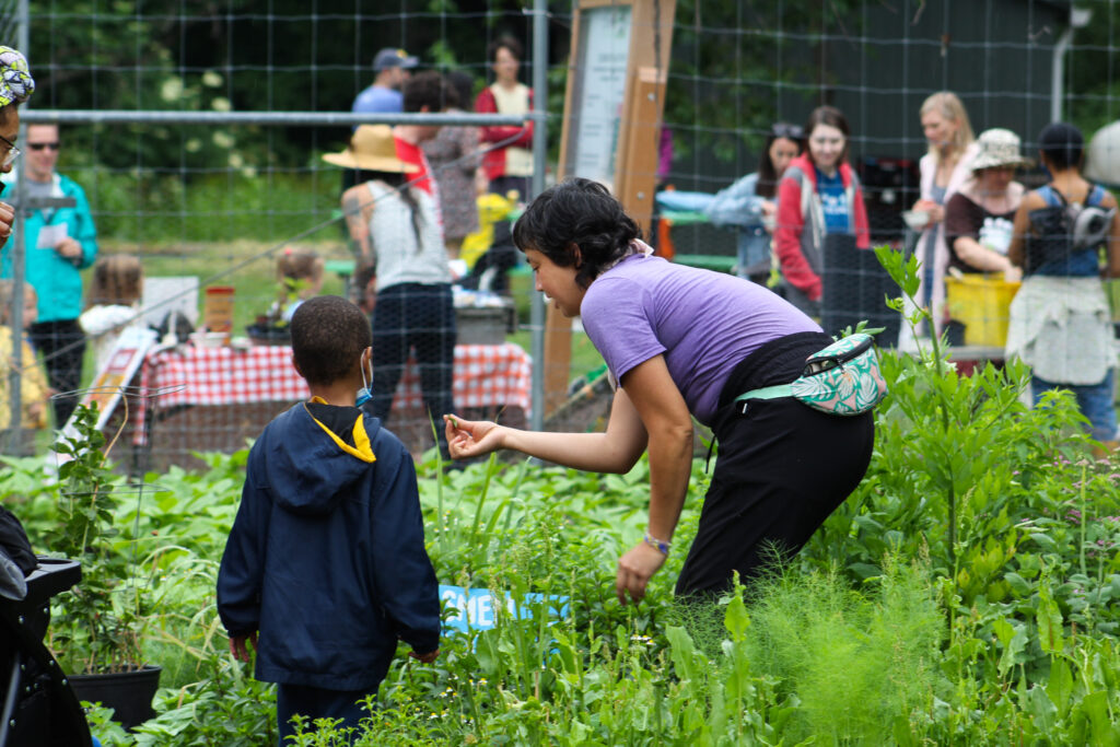 fona staff showing kids the garden during the washington youth garden 50th anniversary birthday party