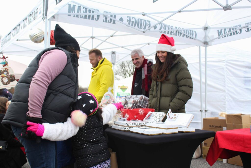winter festival attendees shopping from vendors