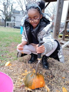 students smashing pumpkins at friendship woodridge