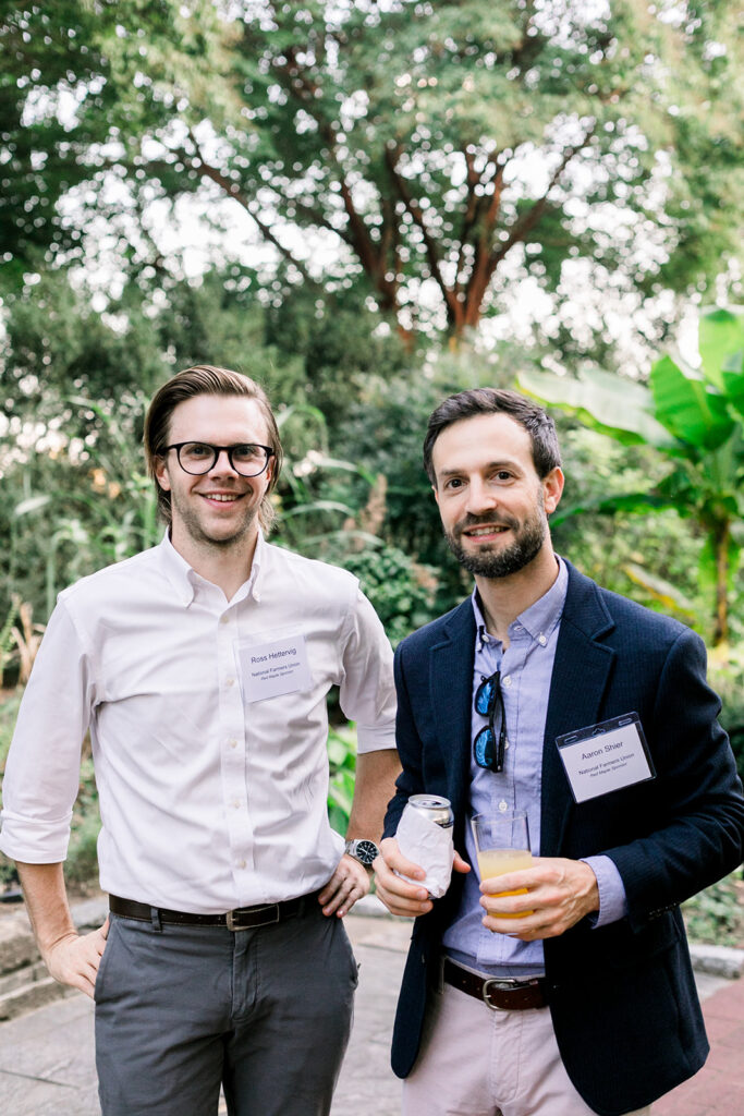 Dinner under the stars attendees in the national herb garden during cocktail hour