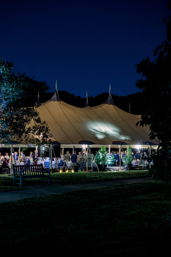 tent illuminated at night for dinner under the stars