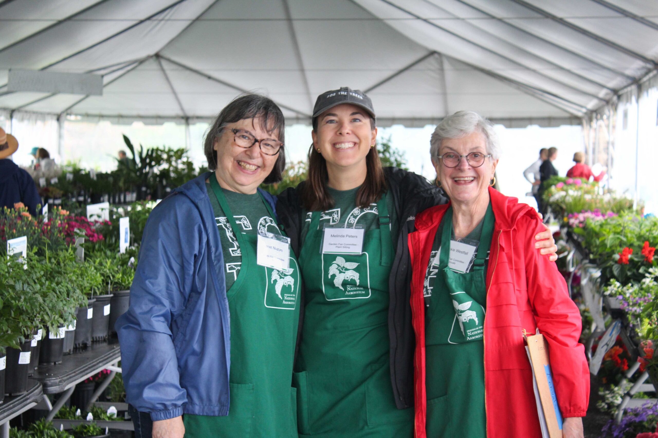 Volunteers at the 2025 Garden Fair & Plant Sale post in the plant sale tent