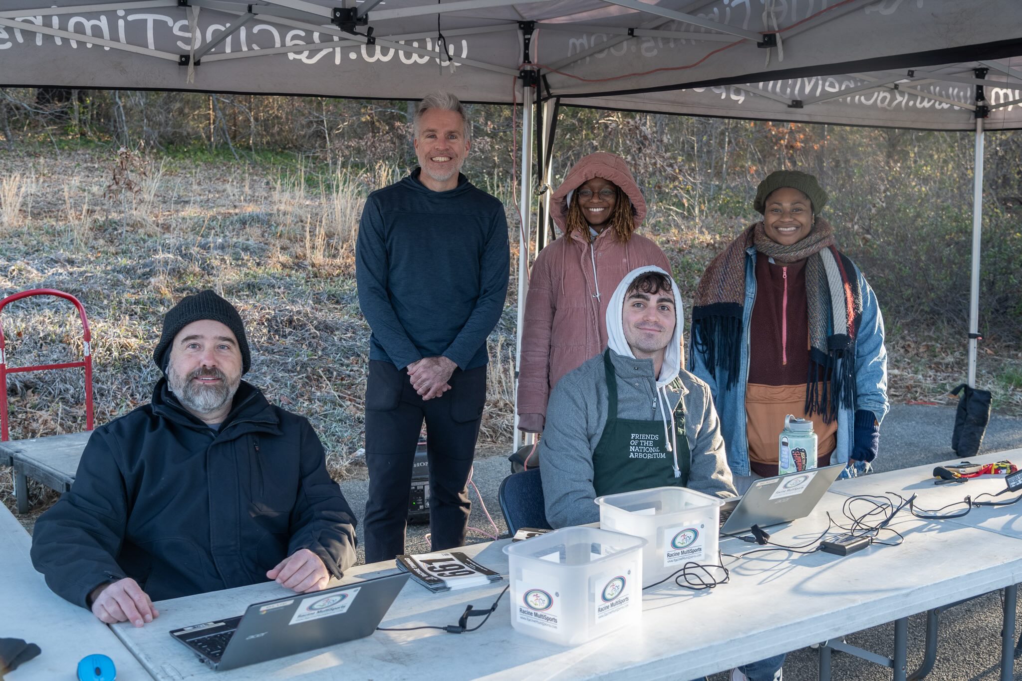 Flowering 5K volunteers help check racers into the event. Photo by Beth Haubach