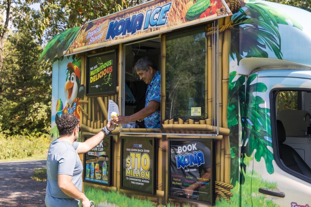 KONA Ice truck serving shaved ice during an event at the Washington Youth GArden