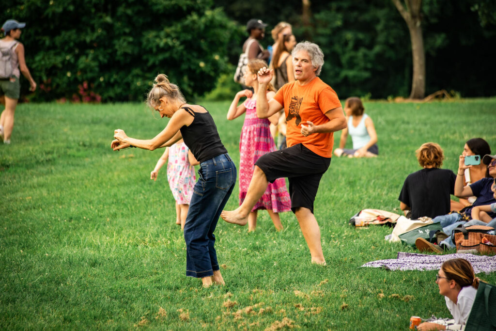 two concert attendees dance to buck forty nine's music