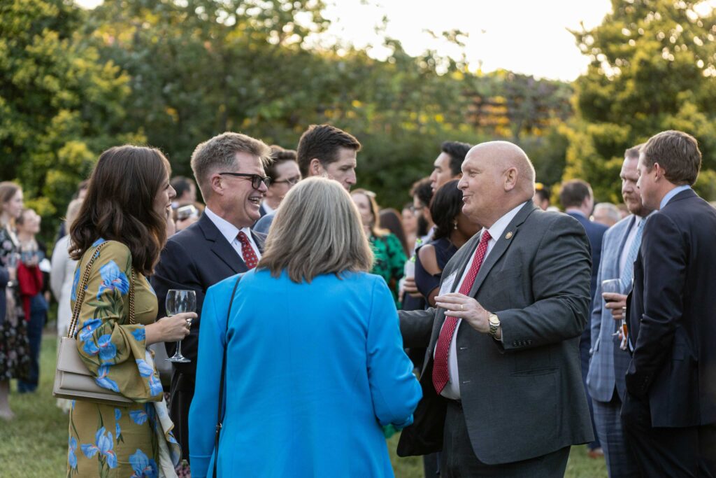 Dinner Under the Stars guests standing and talking with Representative Glenn Thompson (R-PA)