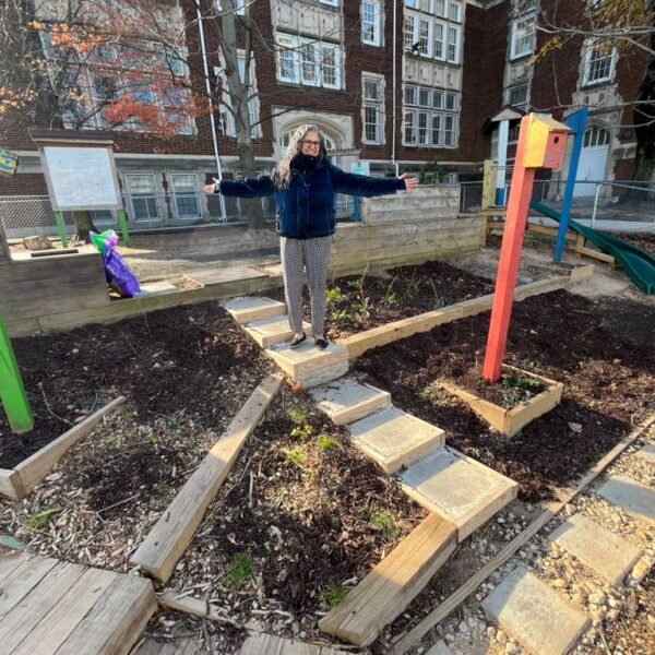 Sabina (teacher) showing off the newly renovated outdoor classroom at Bruce-Monroe ES