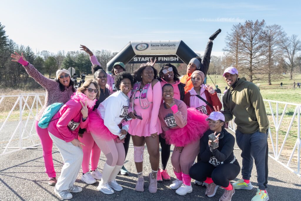 flowering 5k race participants pose by the finish line, photo by beth haubach