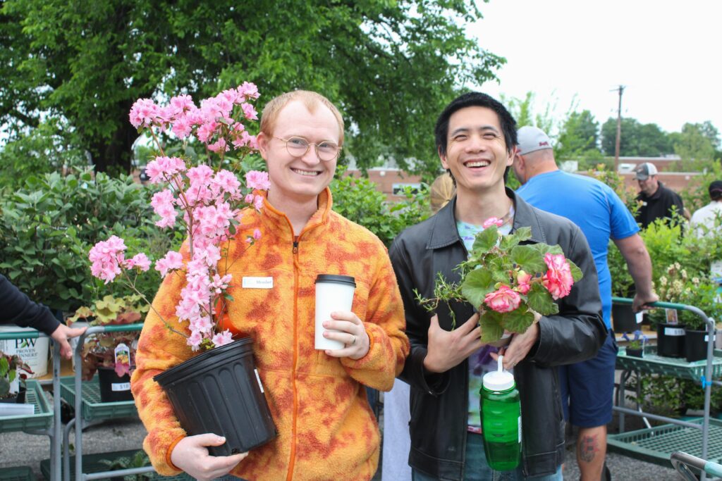 two fona members with plants at the garden fair and plant sale