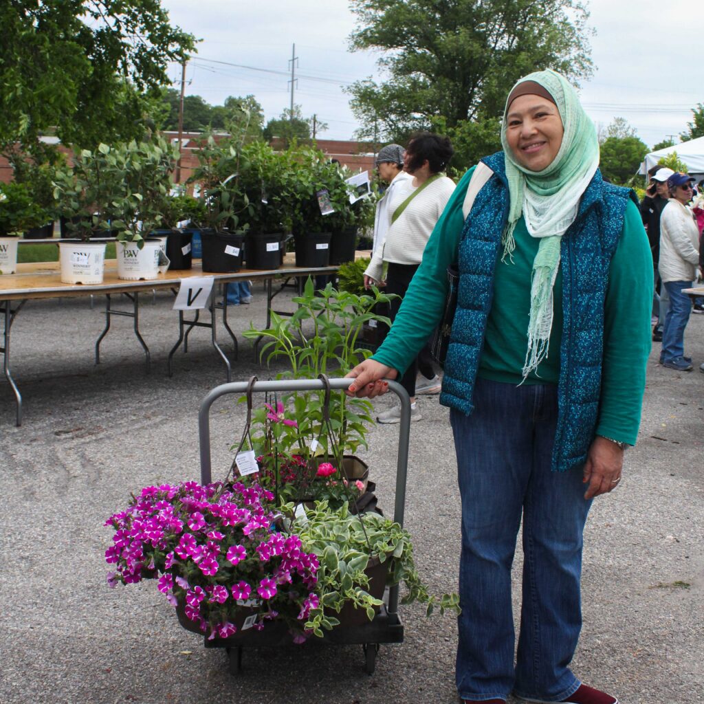 garden fair shopper with their cart of plants