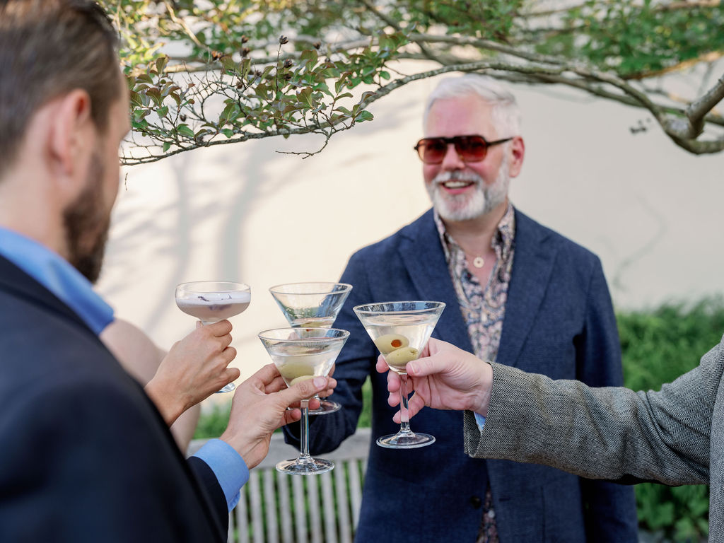 Guests at the 2026 spring soiree in the national bonsai and penjing museum, cheersing with cocktail glasses