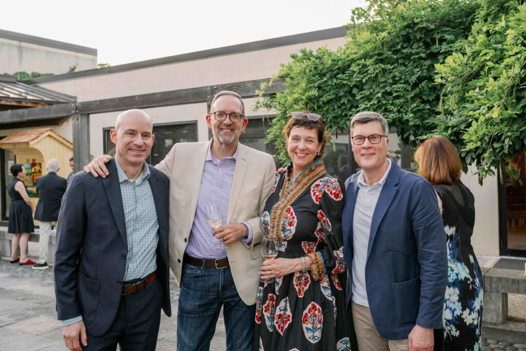 Guests at the 2026 spring soiree in the national bonsai and penjing museum, smiling at the camera